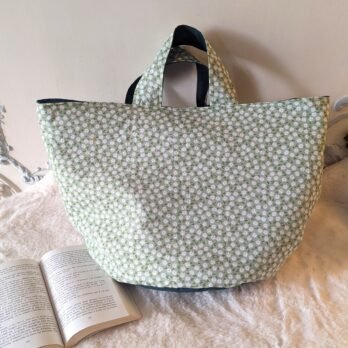 Sac rond, doublé , avec une poche intérieure, des petites paquerettes